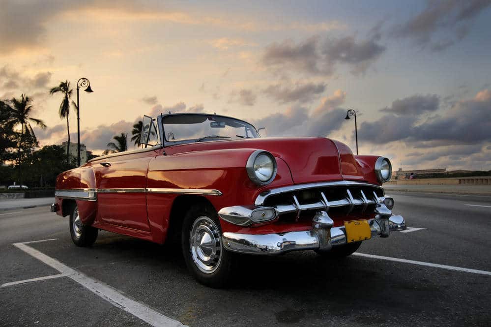 Red Classic Car in the Sunset - Import Cars from Europe to USA