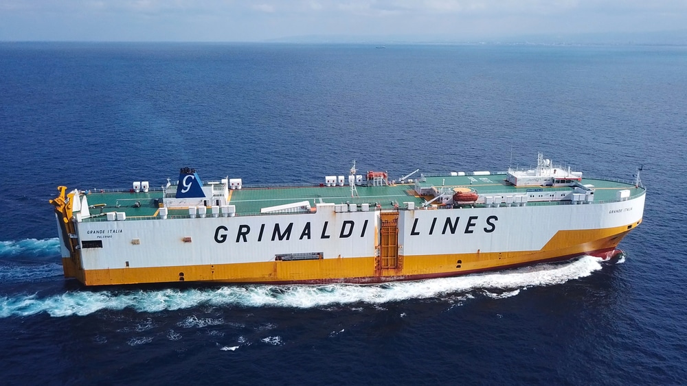 Aerial side view of Grimaldi Lines RoRo vessel at sea