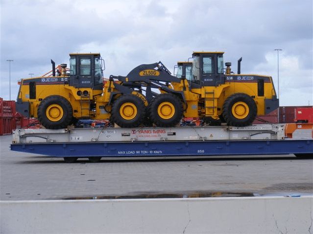 Heavy machinery loaders on port transporter