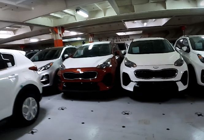 New cars parked and secured inside RoRo vessel
